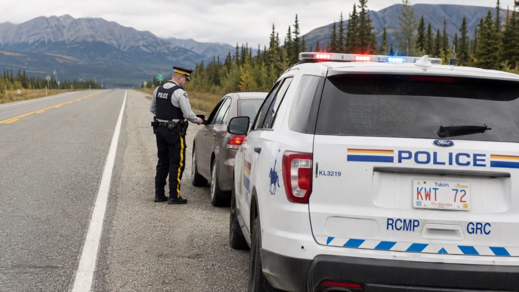 Police stop along a mountain highway